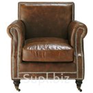 Коричневое кресло Бодлер.Обивка: окрашенная кожа с искусственным лицом, коричневого цвета, состаренная.