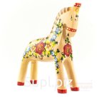 Palomino horse with a scattering of summer flowers