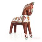 A chestnut horse with a turquoise and red pattern