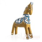 A palomino horse with a blue and white pattern